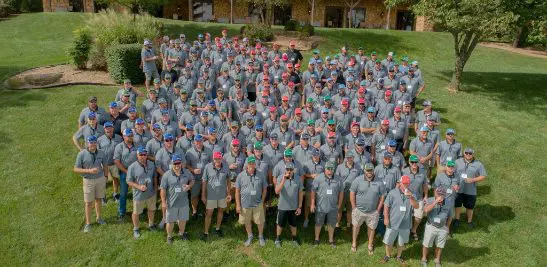 Large group of Crossland employees posing outside.