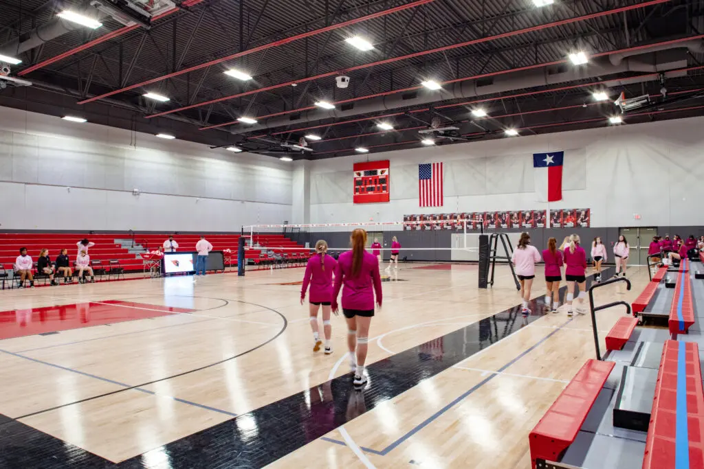 A group of people in a gym.