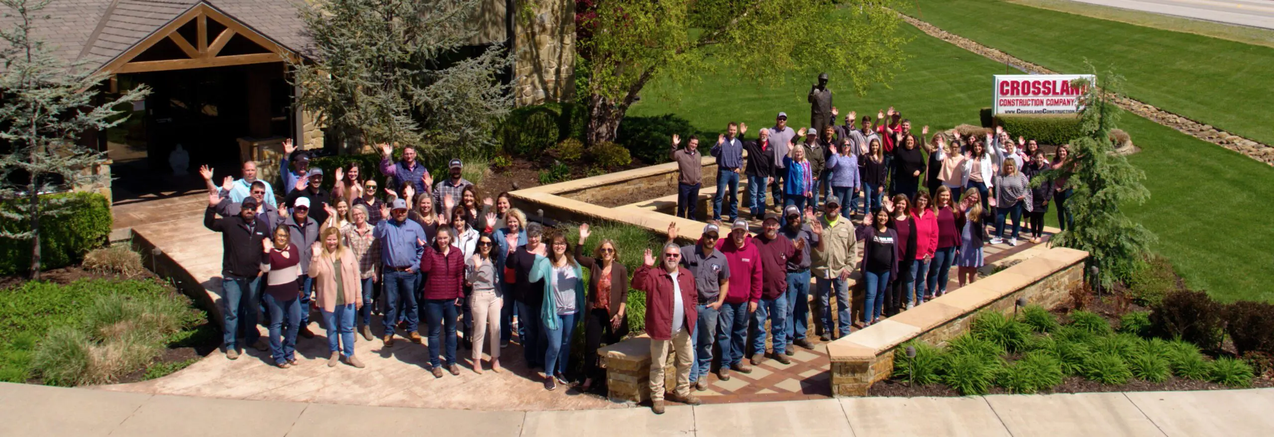 Large group of Crossland employees posing at a Crossland office.