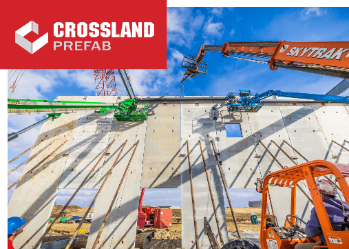 Crossland Prefab with machinery erecting a wall on job site.