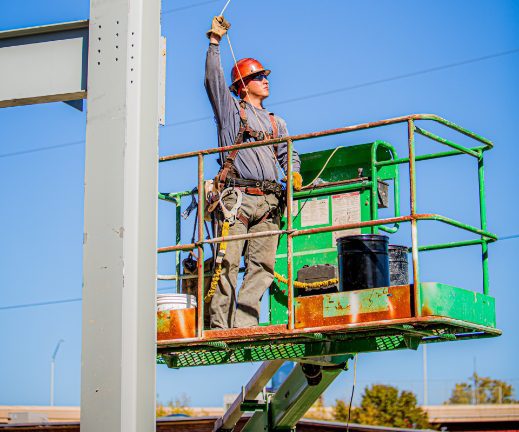 Construction worker on boom lift.