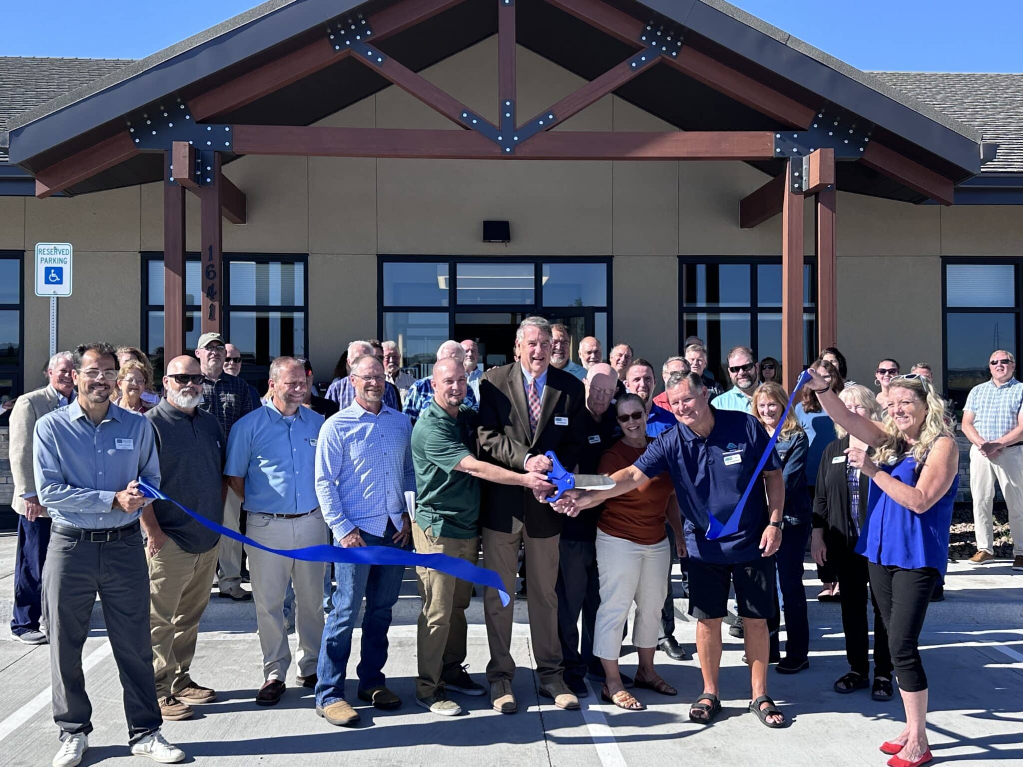 Crowd celebrating the Triview ribbon cutting