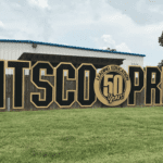 Pitsco Pride sign in front of warehouse which was purchased by Crossland.