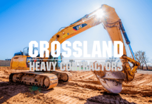 A yellow Crossland excavator sits on a construction site under a clear blue sky. The text "Crossland Heavy Contractors" is prominently displayed across the center of the image.