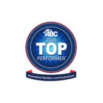 A blue circular badge with "ABC 2026 Top Performer" in white text, and a red ribbon below reading "Associated Builders and Contractors.